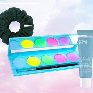 chelsea king windsor scrunchie in hunter green, suva beauty hydra liner palette un uv taffies, and Paula's Choice Resist Youth-Extending Daily Hydrating Fluid SPF 50 on cloudy pastel background